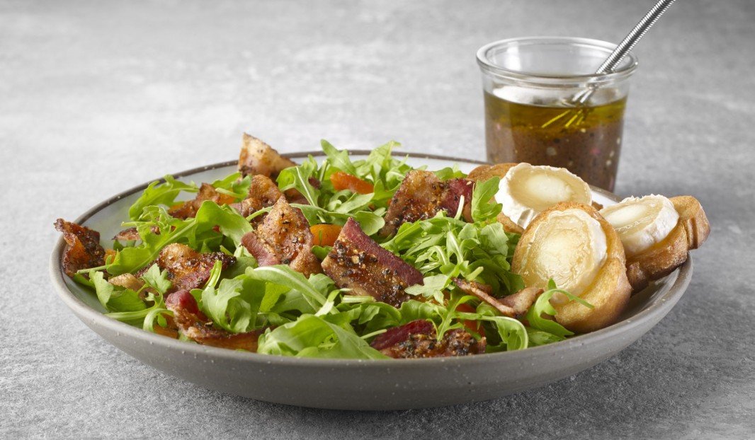 Arugula salad with peppered bacon, balsamic vinaigrette and goat cheese croutons