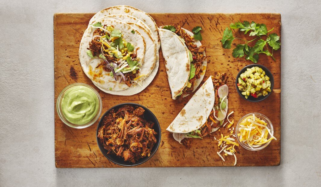 Tacos with pulled pork, corn and avocado ranch 