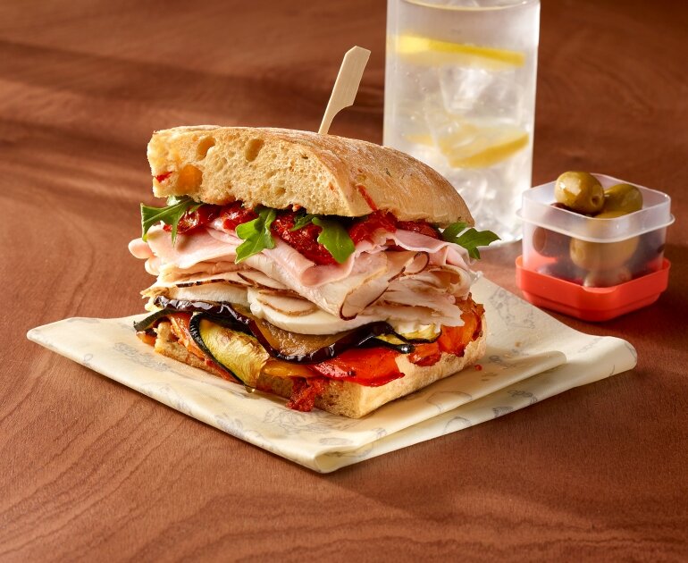 Italian sandwich with turkey, ham and roasted vegetables 